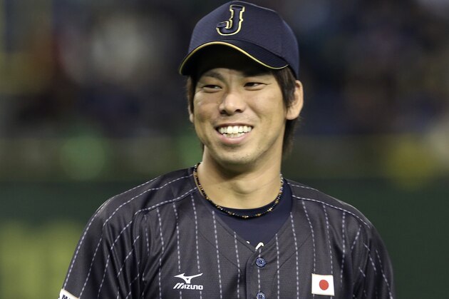 Japan's All-Star Kenta Maeda smiles at the Game 2 of the exhibition baseball game at Tokyo Dome in Tokyo, Friday, Nov. 14, 2014. (AP Photo/Koji Sasahara)