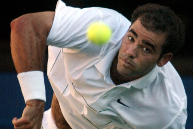 Pete Sampras, of the USA, serves to Andre Agassi, of the USA, during the men's final at the US Open Sunday, Sept. 8, 2002 in New York. (AP Photo/Roberto Borea)
