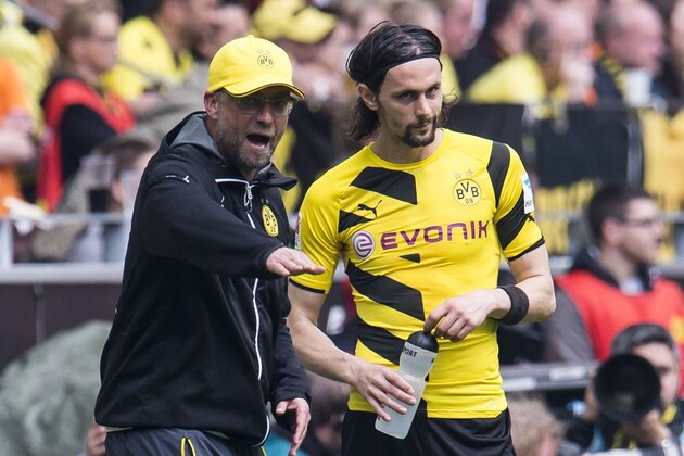 coach Jurgen Klopp of Borussia Dortmund give instructions to Neven Subotic of Borussia Dortmund during the Bundesliga match between Borussia Dortmund and Werder Bremen on May 23, 2015 at the Signal Iduna Park in Dortmund, Germany.(Photo by VI Images via Getty Images)