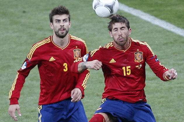 Spain’s Sergio Ramos, right and Spain’s Gerard Pique in action during the Euro 2012 soccer championship final  between Spain and Italy in Kiev, Ukraine, Sunday, July 1, 2012. (AP Photo/Darko Vojinovic)