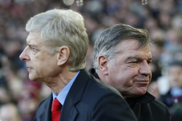 West Ham United's English manager Sam Allardyce (R) greets Arsenal's French manager Arsene Wenger (L) ahead of kick off of the English Premier League football match between West Ham United and Arsenal at the Boleyn Ground, Upton Park, in east London, on December 28, 2014. AFP PHOTO / JUSTIN TALLIS

RESTRICTED TO EDITORIAL USE. No use with unauthorized audio, video, data, fixture lists, club/league logos or live services. Online in-match use limited to 45 images, no video emulation. No use in betting, games or single club/league/player publications.        (Photo credit should read JUSTIN TALLIS/AFP/Getty Images)