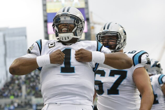 Carolina Panthers quarterback Cam Newton reacts after he rushed for a touchdown in the first half of an NFL football game against the Seattle Seahawks, Sunday, Oct. 18, 2015, in Seattle. (AP Photo/Elaine Thompson) Carolina Panthers quarterback Cam Newton reacts after he rushed for a touchdown in the first half of an NFL football game against the Seattle Seahawks, Sunday, Oct. 18, 2015, in Seattle. (AP Photo/Elaine Thompson)