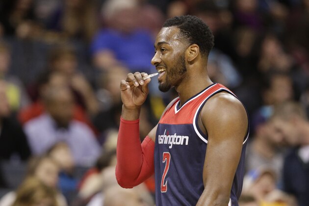 Washington Wizards' John Wall (2) walks down the court in the second half of an NBA basketball game against the Charlotte Hornets in Charlotte, N.C., Wednesday, Nov. 25, 2015. The Hornets won 101-87. (AP Photo/Chuck Burton)