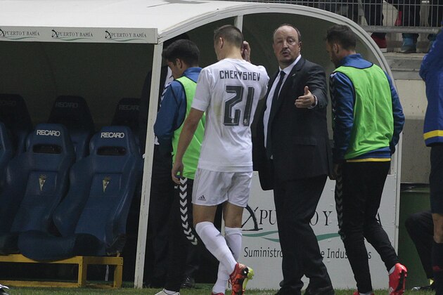 Real Madrid's Cherishev walks off the field as Rafa Benitez gestures during a Copa del Rey soccer match between Cadiz and Real Madrid at the Ramon de Carranza stadium in Cadiz, Spain, Wednesday Dec. 2, 2015. (AP Photo/Angel Fernandez)
