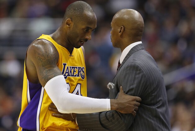Los Angeles Lakers guard Kobe Bryant (24) talks with head coach Byron Scott as while coming out of an NBA basketball game in the second half against the Washington Wizards, Wednesday, Dec. 3, 2014, in Washington. The Wizards won 111-95. (AP Photo/Alex Brandon) Los Angeles Lakers guard Kobe Bryant (24) talks with head coach Byron Scott as while coming out of an NBA basketball game in the second half against the Washington Wizards, Wednesday, Dec. 3, 2014, in Washington. The Wizards won 111-95. (AP Photo/Alex Brandon)