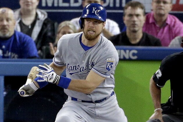 Kansas City Royals' Ben Zobrist drives in Alcides Escobar during the first inning in Game 3 of baseball's American League Championship Series  against the Toronto Blue Jays on Monday, Oct. 19, 2015, in Toronto. (AP Photo/Charlie Riedel)