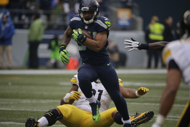 Seattle Seahawks' Thomas Rawls (34) rushes against the Pittsburgh Steelers in the first half of an NFL football game, Sunday, Nov. 29, 2015, in Seattle. (AP Photo/John Froschauer)