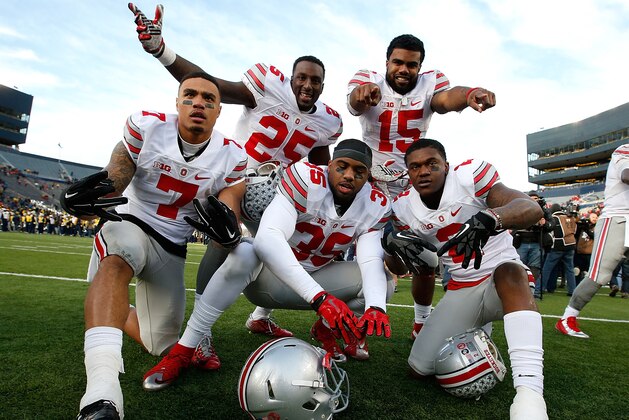 ANN ARBOR, MI - NOVEMBER 28:  Ezekiel Elliott #15, Bri'onte Dunn #25, Jalin Marshall #7, Chris Worley #35 and Dontre Wilson #2 of the Ohio State Buckeyes celebrate a 42-13 win over the Michigan Wolverines at Michigan Stadium on November 28, 2015 in Ann Arbor, Michigan.  (Photo by Gregory Shamus/Getty Images)