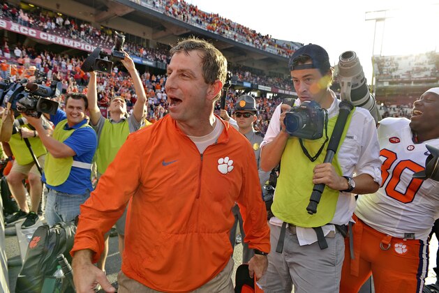 Clemson head coach Dabo Swinney celebrates with the fans after an NCAA college football game against South Carolina Saturday, Nov. 28, 2015, in Columbia, S.C. Clemson won 37-32. (AP Photo/Richard Shiro)