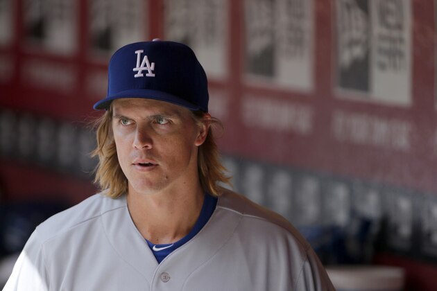 Los Angeles Dodgers pitcher Zack Greinke paces in the dugout during the seventh inning of a baseball game against the Arizona Diamondbacks Sunday, April 12, 2015, in Phoenix.  The Dodgers defeated the Diamondbacks 7-4. (AP Photo/Ross D. Franklin)