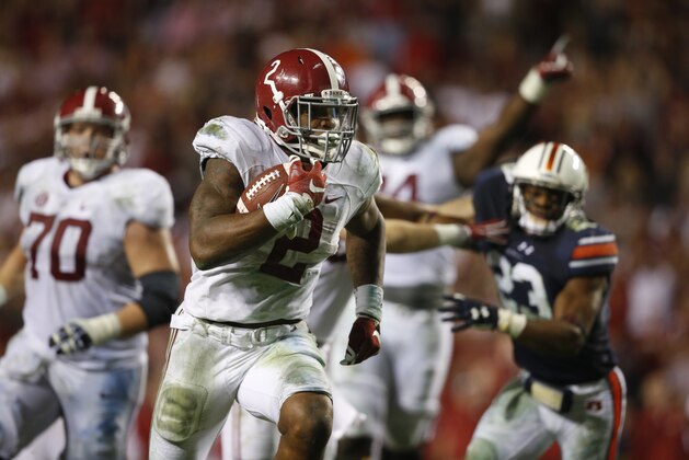 Alabama running back Derrick Henry (2) runs the ball and scores a touchdown during the second half of an NCAA college football game, Saturday, Nov. 28, 2015, in Auburn, Ala. Alabama won 29-13. (AP Photo/Gerald Herbert)