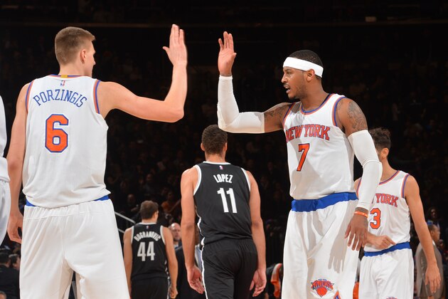 NEW YORK,NY - DECEMBER 4: Kristaps Porzingis #6 and Carmelo Anthony #7 of the New York Knicks give each other highfives against the Brooklyn Nets at Madison Square Garden on December 4, 2015 in New York,New York NOTE TO USER: User expressly acknowledges and agrees that, by downloading and/or using this Photograph, user is consenting to the terms and conditions of the Getty Images License Agreement. Mandatory Copyright Notice: Copyright 2015 NBAE (Photo by Jesse D. Garrabrant/NBAE via Getty Images) NEW YORK,NY - DECEMBER 4: Kristaps Porzingis #6 and Carmelo Anthony #7 of the New York Knicks give each other highfives against the Brooklyn Nets at Madison Square Garden on December 4, 2015 in New York,New York NOTE TO USER: User expressly acknowledges and agrees that, by downloading and/or using this Photograph, user is consenting to the terms and conditions of the Getty Images License Agreement. Mandatory Copyright Notice: Copyright 2015 NBAE (Photo by Jesse D. Garrabrant/NBAE via Getty Images)