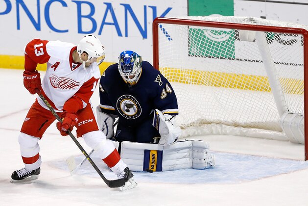 Detroit Red Wings' Pavel Datsyuk, of Russia, looks back as St. Louis Blues goalie Jake Allen blocks a shot on goal during overtime period of an NHL hockey game Saturday, Nov. 21, 2015, in St. Louis. The Detroit Red Wings won 4-3 in overtime. (AP Photo/Scott Kane)