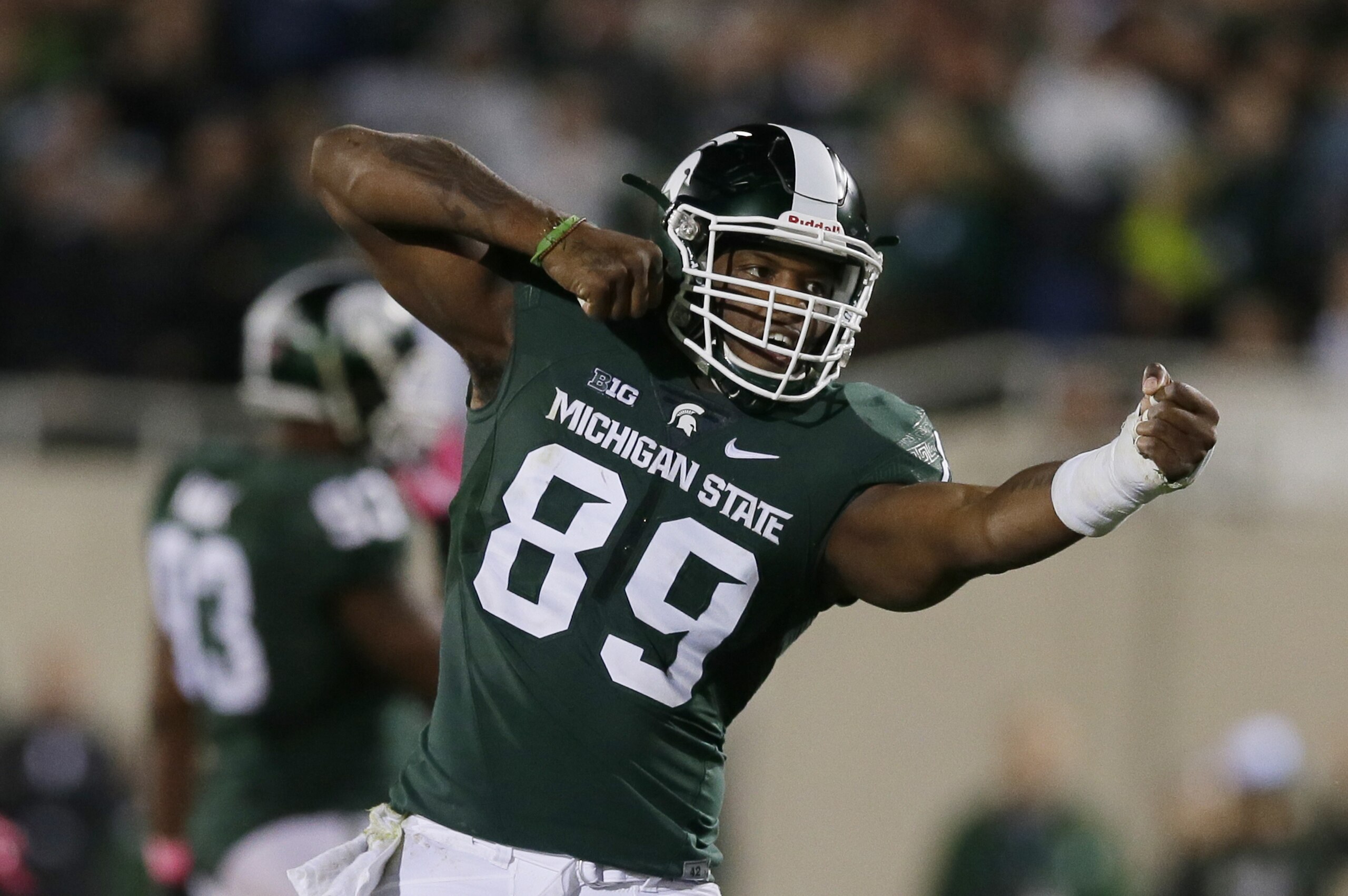 Michigan State defensive end Shilique Calhoun (89) reacts after a sack during the second half of an NCAA college football game against Indiana, Saturday, Oct. 24, 2015, in East Lansing, Mich. (AP Photo/Carlos Osorio)