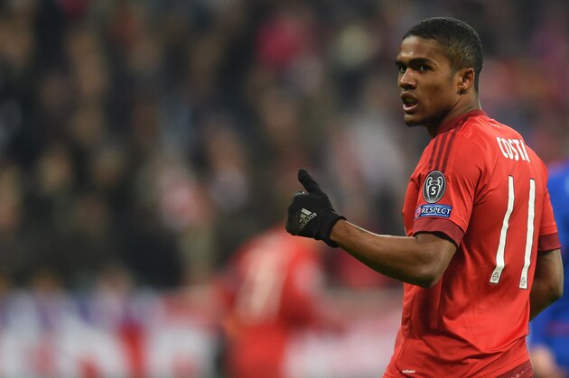 Bayern Munich's Brazilian midfielder Douglas Costa reacts during the UEFA Champions League Group F football match between FCB Bayern Munich and Olympiakos Piraeus on November 24, 2015 at the 'Allianz Arena' in Munich, southern Germany. AFP PHOTO / CHRISTOF STACHE / AFP / CHRISTOF STACHE        (Photo credit should read CHRISTOF STACHE/AFP/Getty Images)