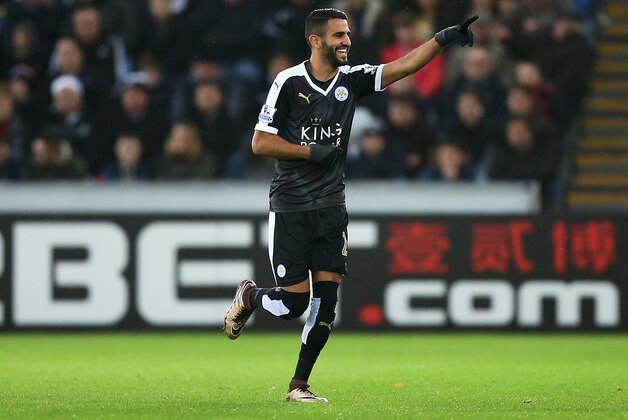 SWANSEA, WALES - DECEMBER 05: Riyad Mahrez of Leicester City celebrates scoring his team's first goal during the Barclays Premier League match between Swansea City and Leicester City at Liberty Stadium on December 5, 2015 in Swansea, Wales.  (Photo by Ben Hoskins/Getty Images)