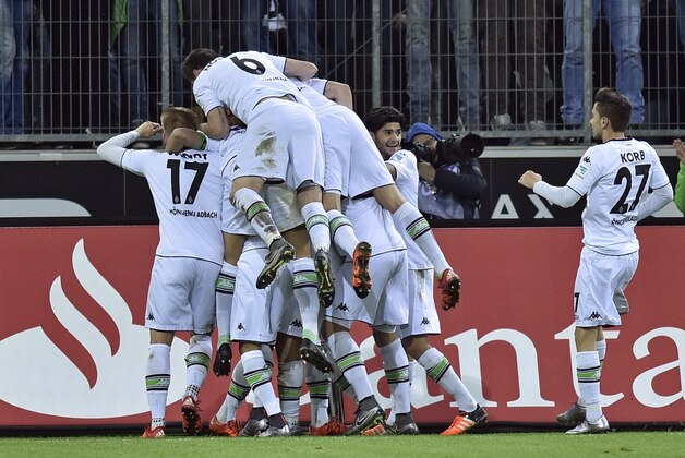 Moenchengladbach's team celebrates the goal by Lars Stindl during the German Bundesliga soccer match between Borussia Moenchengladbach and Bayern Munich in Moenchengladbach, Germany, Saturday, Dec. 5, 2015. (AP Photo/Martin Meissner)