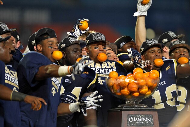 Dec 31, 2014; Miami Gardens, FL, USA; Georgia Tech Yellow Jackets players celebrate their 49-34 win over the Mississippi State Bulldogs in the 2014 Orange Bowl at Sun Life Stadium. Mandatory Credit: Steve Mitchell-USA TODAY Sports