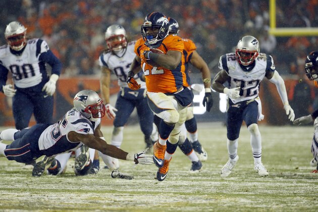 Denver Broncos running back C.J. Anderson (22) breaks free for the game-winning touchdown against the New England Patriots during overtime of an NFL football game, Sunday, Nov. 29, 2015, in Denver. The Broncos defeated the Patriots 30-24. (AP Photo/Jack Dempsey)