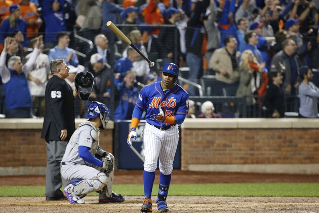 New York Mets Yoenis Cespedes (52) tosses his bat after hitting a fourth-inning, three-run home run in baseball's Game 3 of the National League Division Series, Monday, Oct. 12, 2015, in New York. (AP Photo/Kathy Willens)