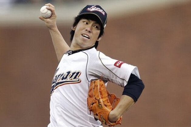 Japan's Kenta Maeda pitches during the first inning of a semifinal game of the World Baseball Classic against Puerto Rico in San Francisco, Sunday, March 17, 2013. (AP Photo/Ben Margot)