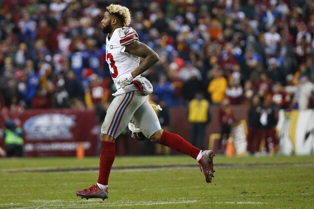 New York Giants wide receiver Odell Beckham (13) runs off the field after his touchdown during the second half of an NFL football game against the Washington Redskins in Landover, Md., Sunday, Nov. 29, 2015. The Washington Redskins defeated the New York Giants 20-14. (AP Photo/Alex Brandon)