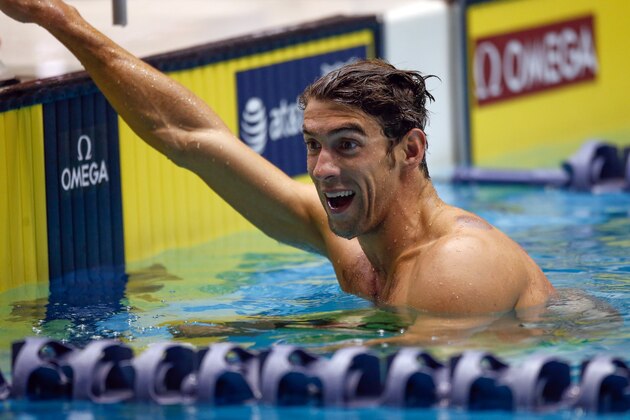 FEDERAL WAY, WA - DECEMBER 05:  Michael Phelps reacts after winning the preliminary 200 Meter Butterfly during the AT&T Winter National Championships at the Weyerhaeuser King County Aquatic Center on December 5, 2015 in Federal Way, Washington.  (Photo by Otto Greule Jr/Getty Images)