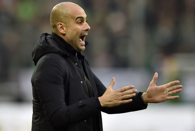 Bayern head coach Pep Guardiola shouts during the German Bundesliga soccer match between Borussia Moenchengladbach and Bayern Munich in Moenchengladbach, Germany, Saturday, Dec. 5, 2015. (AP Photo/Martin Meissner)