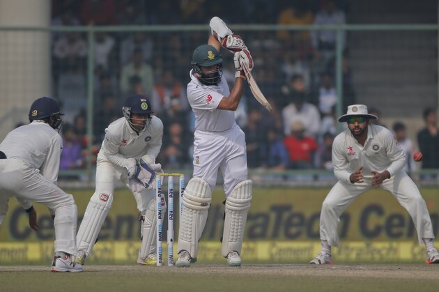 Indian fielders watch as South Africa's captain Hashim Amla bats on day four of their fourth and final test cricket match in New Delhi, India, Sunday, Dec. 6, 2015. (AP Photo/Tsering Topgyal)
