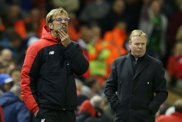 LIVERPOOL, ENGLAND - OCTOBER 25:  Jurgen Klopp (L), manager of Liverpool and Ronald Koeman (R) manager of Southampton look on during the Barclays Premier League match between Liverpool and Southampton at Anfield on October 25, 2015 in Liverpool, England.  (Photo by Jan Kruger/Getty Images)