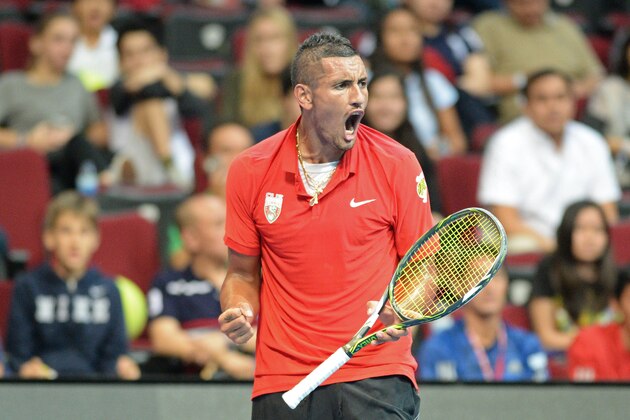 Australia's Nick Kyrgios of the Singapore Slammers celebrates after a point against Germany's Philipp Kohlschreiber of the Japan Warriors during their men's singles match at the International Premier Tennis League (IPTL) in Manila on December 6, 2015.   AFP PHOTO / TED ALJIBE / AFP / TED ALJIBE        (Photo credit should read TED ALJIBE/AFP/Getty Images)