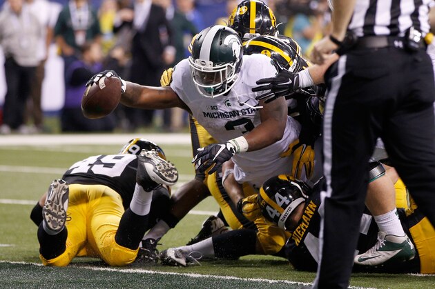 INDIANAPOLIS, IN - DECEMBER 05:  LJ Scott #3 of the Michigan State Spartans reaches into the end zone against the Iowa Hawkeyes in the Big Ten Championship at Lucas Oil Stadium on December 5, 2015 in Indianapolis, Indiana.  (Photo by Joe Robbins/Getty Images)