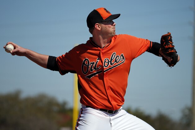 Baltimore Orioles pitcher Darren O'Day throws a bullpen session during a  spring training baseball workout  in Sarasota, Fla., Friday, Feb. 20, 2015.  (AP Photo/Gene J. Puskar)