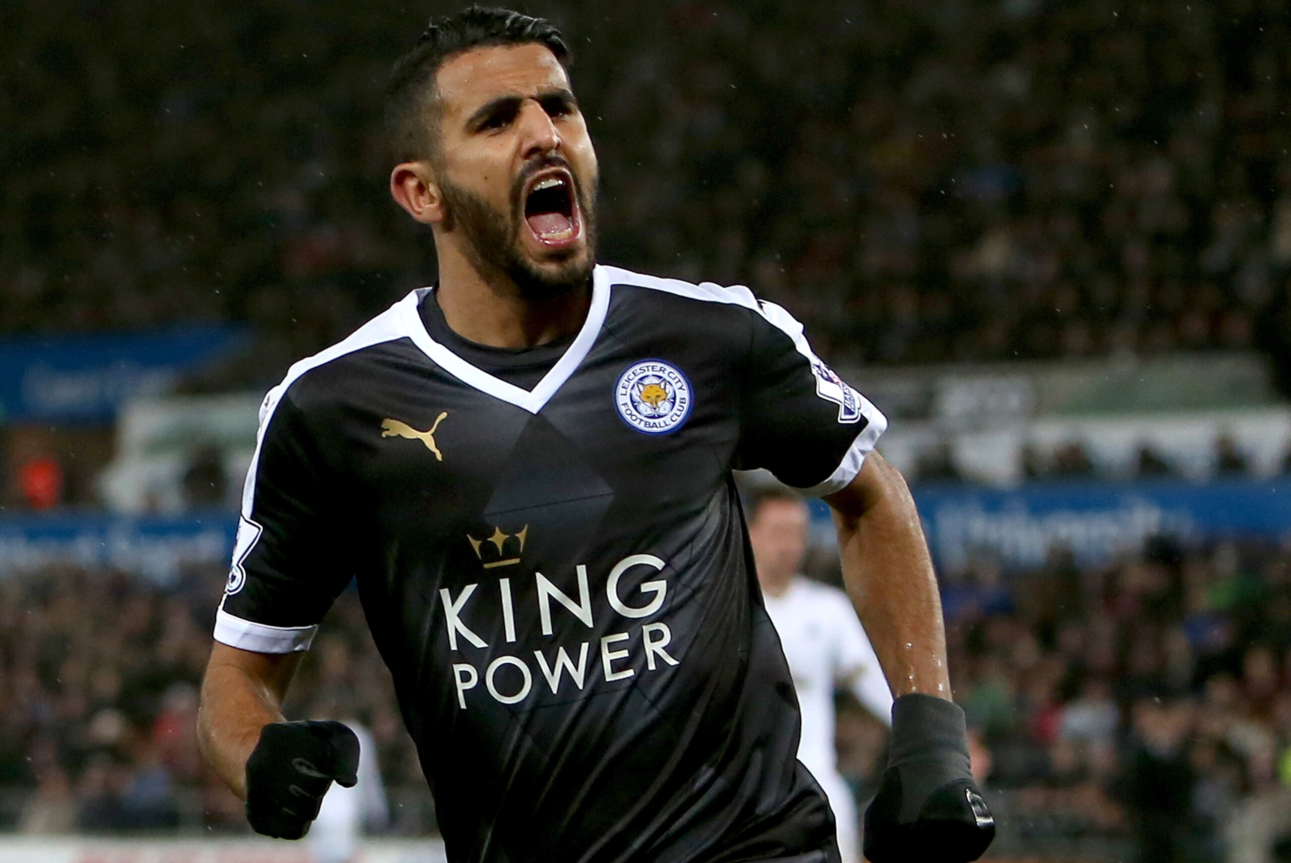 Leicester City's Algerian midfielder Riyad Mahrez celebrates after scoring his third goal during the English Premier League football match between Swansea City and Leicester City at The Liberty Stadium in Swansea, south Wales on December 5, 2015.       AFP PHOTO / GEOFF CADDICK

RESTRICTED TO EDITORIAL USE. No use with unauthorized audio, video, data, fixture lists, club/league logos or 'live' services. Online in-match use limited to 75 images, no video emulation. No use in betting, games or single club/league/player publications. / AFP / GEOFF CADDICK        (Photo credit should read GEOFF CADDICK/AFP/Getty Images)