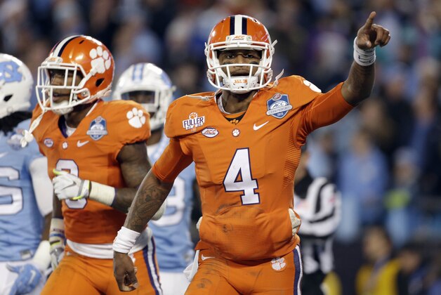 Clemson's Deshaun Watson (4) celebrates his touchdown against North Carolina during the first half of the Atlantic Coast Conference championship NCAA college football game in Charlotte, N.C., Saturday, Dec. 5, 2015. (AP Photo/Bob Leverone)