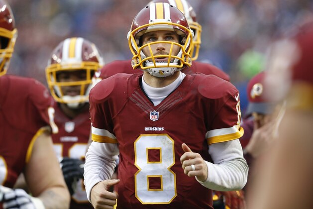 In this photo taken Nov. 29, 2015, Washington Redskins quarterback Kirk Cousins (8) runs off the field at halftime during an NFL football game against the New York Giants in Landover, Md. Without a trace of irony or attempt at humor, Cousins recounted his thoughts from a decade or so ago when discussing the significance of his upcoming start against the Dallas Cowboys on
