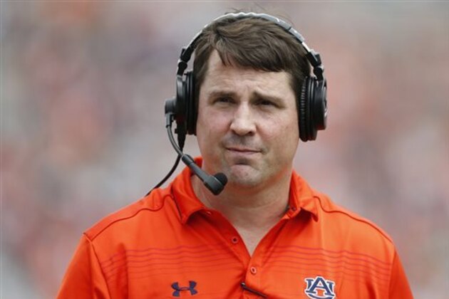 FILE - In this April 18, 2015, file photo, Auburn defensive coordinator Will Muschamp walks around the football field in the first quarter of their spring NCAA college football game in Auburn, Ala. A person with direct knowledge of the decision says Muschamp has agreed to become South Carolina’s next head football coach, and he could be formally introduced as early as Monday, Dec. 7, 2015. (AP Photo/Brynn Anderson, File)