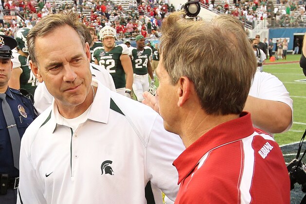 ORLANDO, FL - JANUARY 01:  Alabama Crimson Tide Head Coach Nick Saban greets Michigan State Spartans Head Coach Mark Dantonio after winning the Capitol One Bowl against at the Florida Citrus Bowl on January 1, 2011 in Orlando, Florida.  (Photo by Mike Ehrmann/Getty Images)
