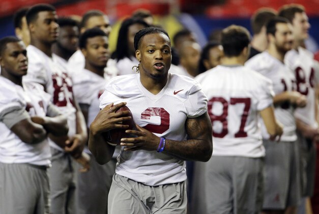 Alabama running back Derrick Henry runs through a drill during a team workout ahead of Saturday's Southeastern Conference championship NCAA college football game against Florida, Friday, Dec. 4, 2015, in Atlanta. (AP Photo/David Goldman)