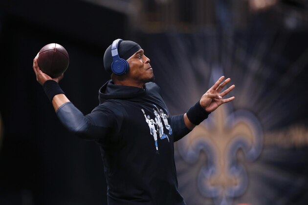 Carolina Panthers quarterback Cam Newton warms up before an NFL football game against the New Orleans Saints in New Orleans, Sunday, Dec. 6, 2015. (AP Photo/Bill Feig)