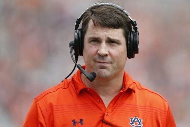 FILE - In this April 18, 2015, file photo, Auburn defensive coordinator Will Muschamp walks around the football field in the first quarter during their spring NCAA college football game in Auburn, Ala. The Tigers are expecting big things from new starting quarterback Jeremy Johnson and new defensive coordinator Will Muschamp. (AP Photo/Brynn Anderson, File)