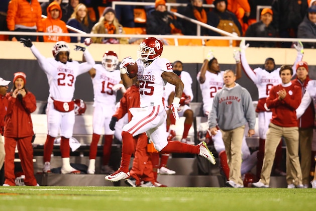 Nov 28, 2015; Stillwater, OK, USA; Oklahoma Sooners running back Joe Mixon (25) runs for a touchdown in the first half against the Oklahoma State Cowboys at Boone Pickens Stadium. Mandatory Credit: Mark J. Rebilas-USA TODAY Sports