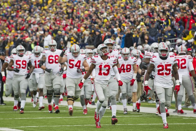 The Ohio State players take to the Michigan Stadium field before an NCAA college football game against Michigan in Ann Arbor, Mich., Saturday, Nov. 28, 2015. (AP Photo/Tony Ding)