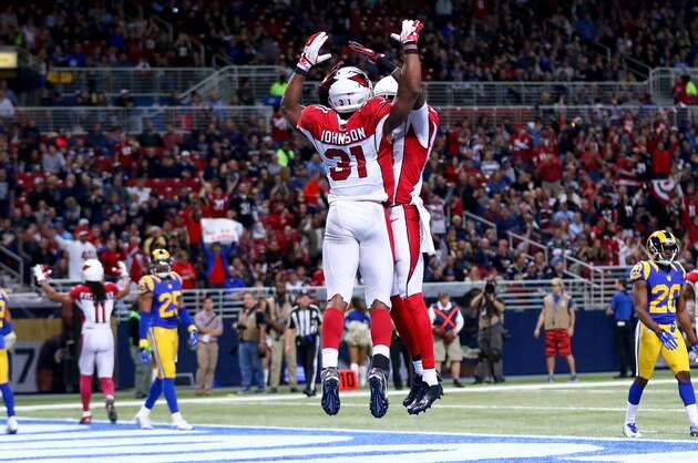 ST. LOUIS, MO - DECEMBER 6: David Johnson #31 of the Arizona Cardinals celebrates with a teammate after scoring a touchdown in the third quarter against the St. Louis Rams at the Edward Jones Dome on December 6, 2015 in St. Louis, Missouri. (Photo by Dilip Vishwanat/Getty Images)
