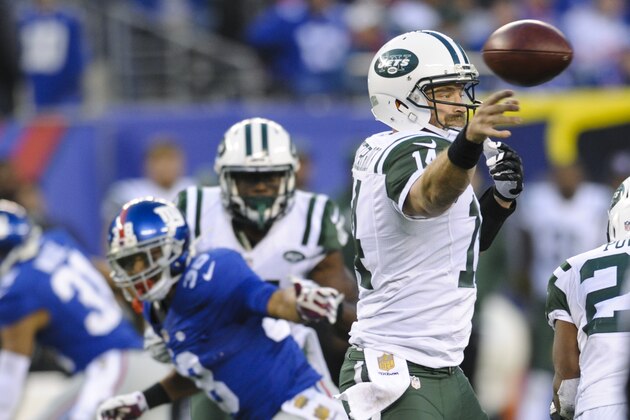 New York Jets quarterback Ryan Fitzpatrick (14) throws a pass during overtime of an NFL football game against the New York Giants Sunday, Dec. 6, 2015, in East Rutherford, N.J. The Jets won 23-20. (AP Photo/Bill Kostroun)