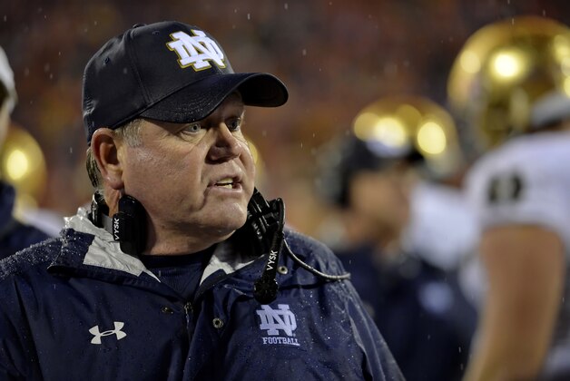 Notre Dame head coach Brian Kelly works in the bench area during the second half of an NCAA college football game against Clemson Saturday, Oct. 3, 2015,  in Clemson,  S.C.  Clemson won 24-22. (AP Photo/Richard Shiro)