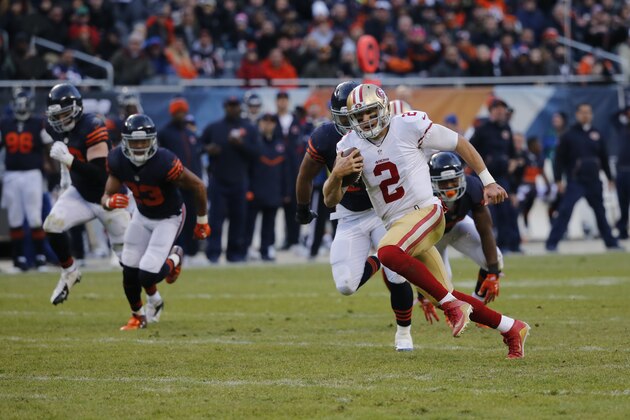 San Francisco 49ers quarterback Blaine Gabbert (2) runs to the end zone for a touchdown during the second half of an NFL football game against the Chicago Bears, Sunday, Dec. 6, 2015, in Chicago. (AP Photo/Charles Rex Arbogast)