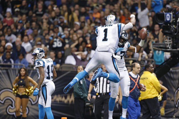 Carolina Panthers wide receiver Devin Funchess (17) celebrates his touchdown reception with quarterback Cam Newton (1) in the second half of an NFL football game against the New Orleans Saints in New Orleans, Sunday, Dec. 6, 2015. (AP Photo/Jonathan Bachman)