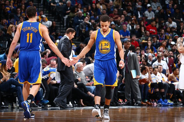 BROOKLYN, NY - DECEMBER 6: Stephen Curry #30 and Klay Thompson #11 of the Golden State Warriors high five each other during the game against the Brooklyn Nets on December 6, 2015 at Barclays Center in Brooklyn, New York. NOTE TO USER: User expressly acknowledges and agrees that, by downloading and or using this Photograph, user is consenting to the terms and conditions of the Getty Images License Agreement. Mandatory Copyright Notice: Copyright 2015 NBAE (Photo by Nathaniel S. Butler/NBAE via Getty Images)