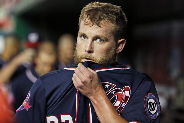 Washington Nationals relief pitcher Drew Storen (22) walks in the dugout during the eighth inning a baseball game at Nationals Park, Wednesday, Sept. 9, 2015, in Washington.  The Mets won 5-3. (AP Photo/Alex Brandon)